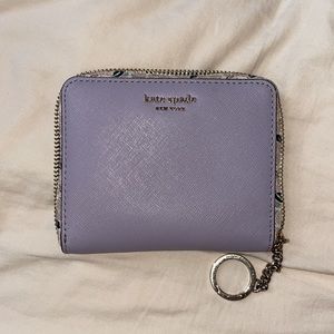 Purple kate spade wallet with floral details! In near perfect condition